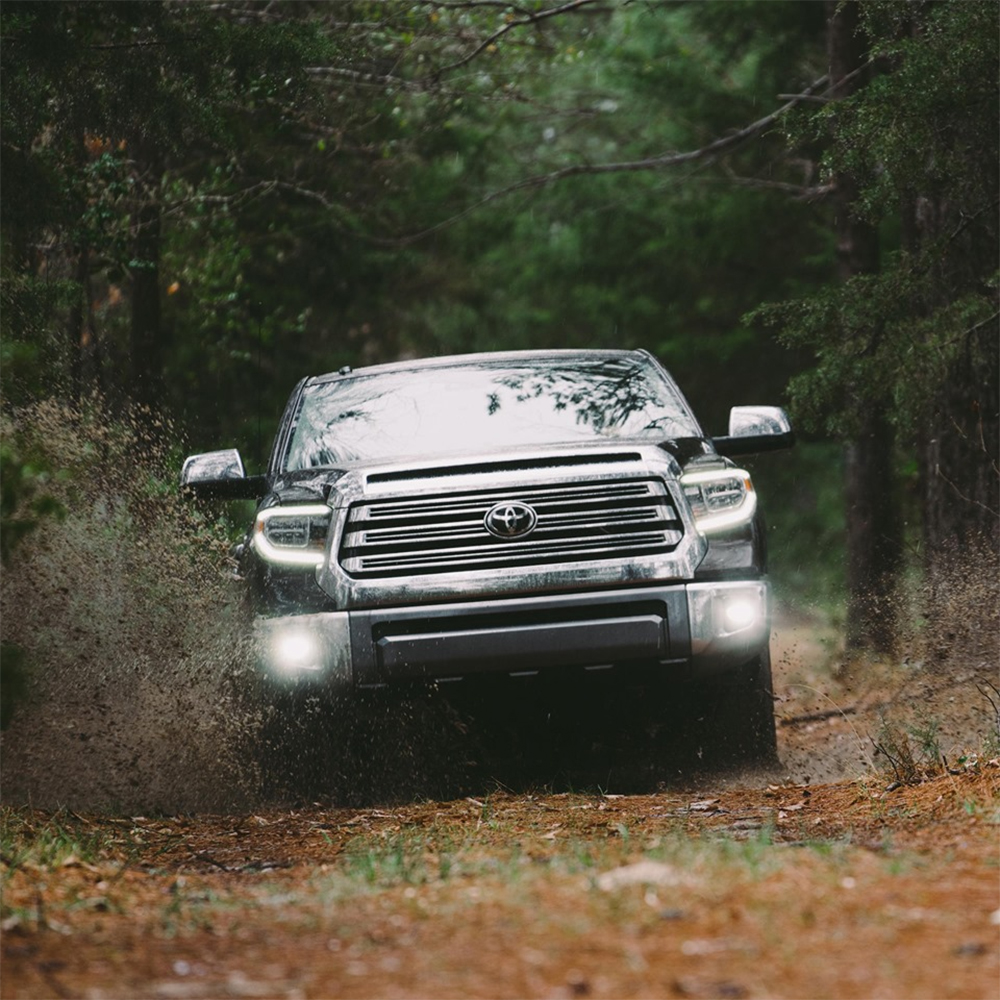 Toyota Tundra Plowing Through Mud In The Woods